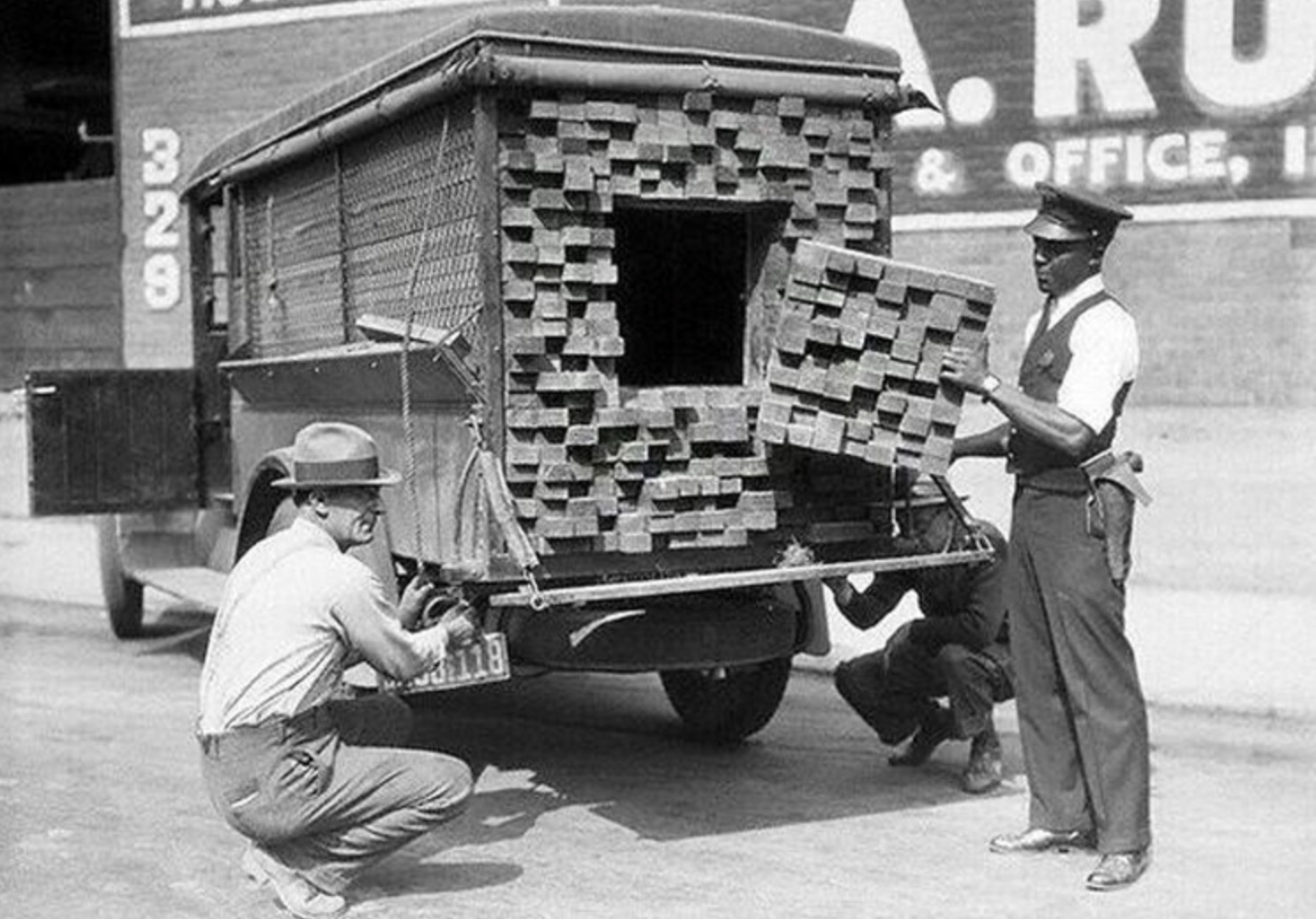 A federal agent inspects a ‘lumber’ truck after smelling alcohol during Prohibition in Los Angeles
